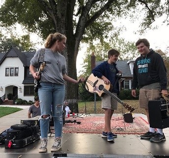 2 teen music band members and a roadie